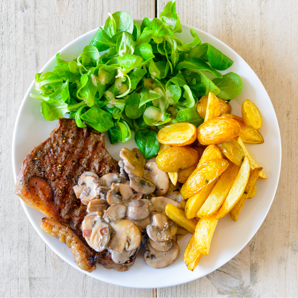 meal with steak, potatoes, and salad